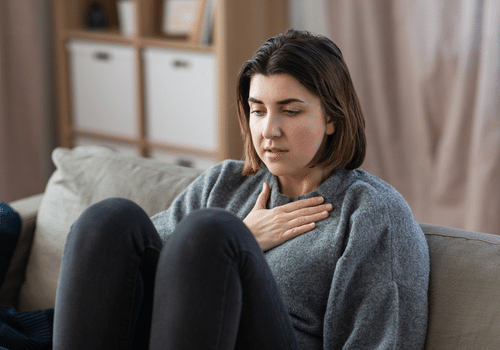 person holding chest