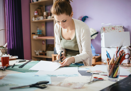 person cutting paper